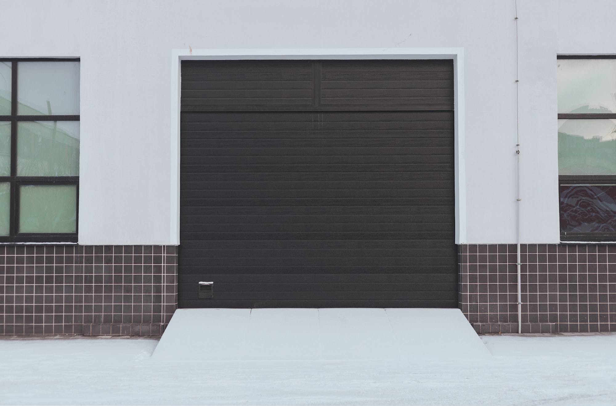 Automatic metal roller door in storage and industrial warehouse.
